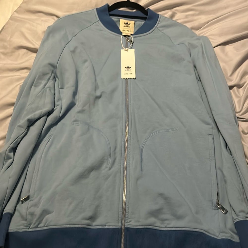 Men’s brand new with tags Kith Adidas Oyster zip up light blue